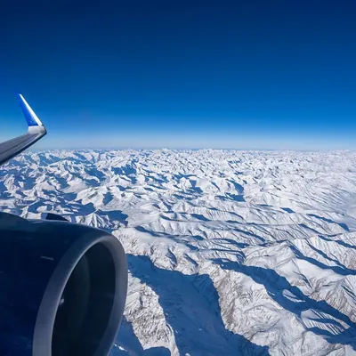 The view from my window seat on a flight to Leh for the Snow Leopard Expedition. The endless expanse of snow-covered Himalayas is a visual treat and a powerful reminder of nature's scale.