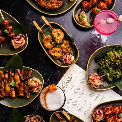 A beautifully styled spread for China Bistro, showcasing a variety of dishes in a single, compelling top-down shot. This type of photography is perfect for menu covers, banners, and highlighting the breadth of your offerings.