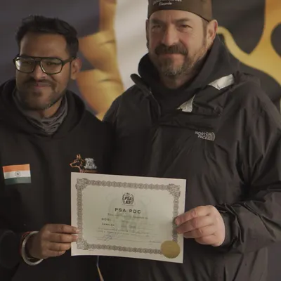 This is the goal: a title from a respected organization. Here I am receiving the PSA PDC certificate for my Dutch Shepherd, Angel, after she passed her trial with excellent marks.