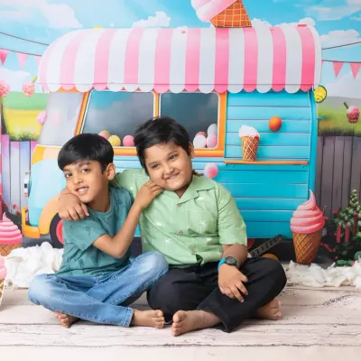 Summer fun with an ice cream themed mini session. This colorful and playful setup is perfect for capturing the sweet smiles of siblings.