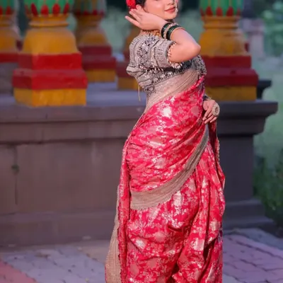 A client looking graceful in a traditional pink Navvari saree. This nine-yard wonder is perfect for bringing Maharashtrian heritage to life at any celebration.