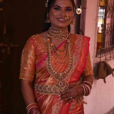 This beautiful bride is ready for her big day. I pre-pleated her stunning South Indian bridal saree, paying close attention to the layers of temple jewelry she would be wearing to ensure a comfortable and regal fit.