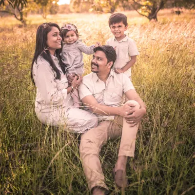 Relaxing in a field of gold. This outdoor family portrait has a warm, rustic feel that is both timeless and authentic.
