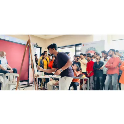 A live painting demonstration in progress at Abhinav Kala Mahavidyalaya in Pune. You can see the students gathered to observe the process, which is a core part of my educational workshops.