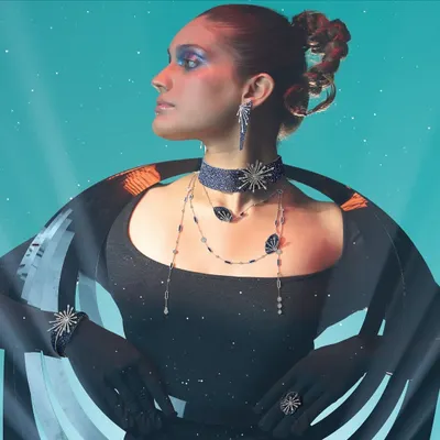 In this high-fashion editorial for Popley Eternal, the styling was conceptual and futuristic. I used a structured black gown and dramatic jewelry to create a celestial narrative, transforming the model into a cosmic entity.