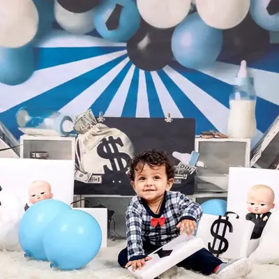 Who's the boss? This little guy is, in our popular 'Boss Baby' themed photoshoot. We provide all the props, including money bags and a tiny briefcase, for a fun and powerful portrait.