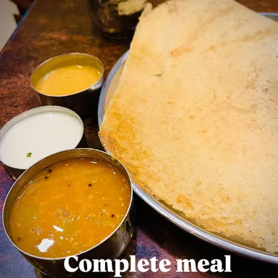 A classic South Indian meal of dosa with sambar and chutneys is a perfect example of a complete meal. The fermented dosa is great for gut health, while the lentil based sambar provides protein and fiber, making it a balanced and nutritious choice.