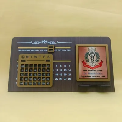 This infinity calendar is a fantastic corporate gift. It features a perpetual calendar, a phone stand, and a customizable plate where I can add your company or event logo, like this one for the IMA Rohini Zone.