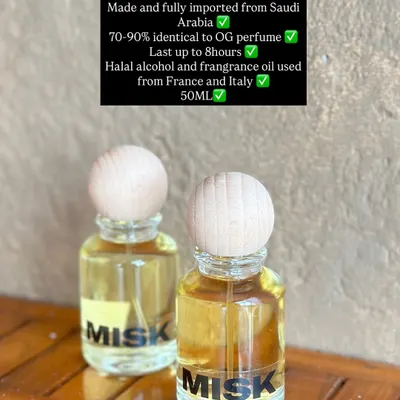 A close-up of my Saudi Inspired Perfume. The 50ml glass bottle is simple and elegant, focusing on the high-quality fragrance inside.