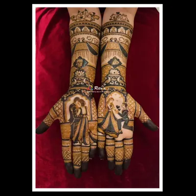 A full view of a stunning bridal mehendi featuring two distinct couple portraits. One hand shows a romantic embrace, while the other captures a proposal moment, telling a complete love story.