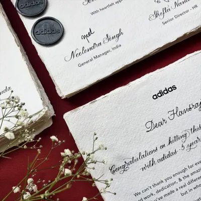 A throwback to a thoughtful project for Adidas India, honoring team members hitting incredible milestones. Over 75 notes were crafted on handmade paper, combining typed font with digital calligraphy, and then individually hand-addressed.