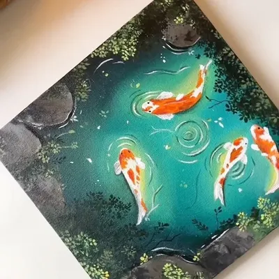 A close up of my finished acrylic painting of a koi pond. I focused on the vibrant orange and white of the fish against the deep teal water, with small ripples showing their gentle movement.