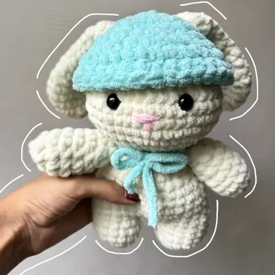 This fluffy crochet bunny plushie is made with super soft velvet yarn, making it extra cuddly. The little blue hat and bow add a touch of cuteness.