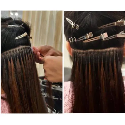 This is a close-up of the meticulous process for applying permanent extensions. Each strand is carefully bonded to create a look that is secure, comfortable, and completely natural.