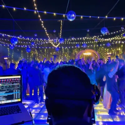 A beautiful sangeet night in Rajkot, Gujarat. I travel all over India for destination weddings, bringing my complete professional setup to create an incredible party atmosphere with stunning lighting and sound.