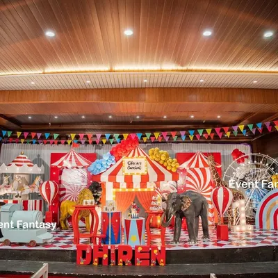 Step right up to Dhiren's grand carnival party. This vibrant indoor stage is filled with classic carnival elements, including a red and white striped big top, a carousel, a Ferris wheel, and friendly animal props, creating an atmosphere of fun and excitement for everyone.