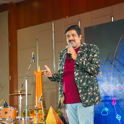 On stage at the Gulf Oil 'Unlock' event. As a corporate event emcee, I focus on keeping the energy high and the program running smoothly for all the attendees.