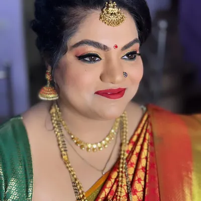This client's only request for her daughter's naming ceremony was glittery eyes, and I was happy to deliver. This bold look features gold glitter, winged liner, and a classic red lip.