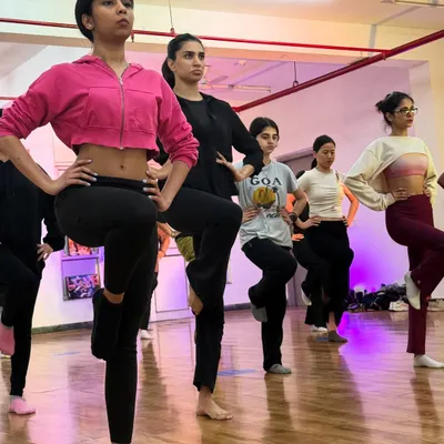 We start every class with a proper warm up and technical drills, like this balancing exercise. Building a strong foundation in jazz technique is key to improving your dance skills.