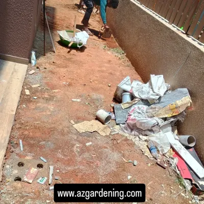 The first step in any installation is a thorough site clearing. Here, my team is removing all debris and old construction materials from a side yard.
