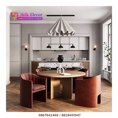Our custom work extends to dining spaces. Here, we designed a set of plush, curved dining chairs in a rich terracotta fabric to surround a modern wooden table. These chairs are crafted not just for style, but for exceptional comfort during long meals and conversations.