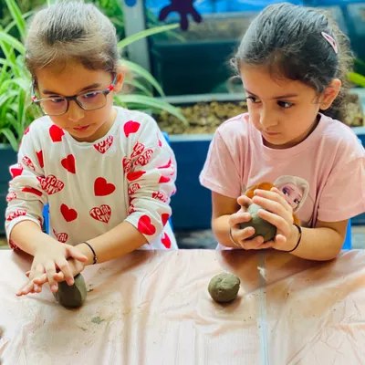 Two young artists working together on their clay Ganeshas for our Ganesh Chaturthi workshop. Our workshops are a wonderful way for kids to learn about cultural traditions through hands-on art.