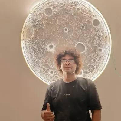Here I am with one of my proudest creations, the 3D textured moon art. This piece is large enough to be a major feature in any room and has a backlight that gives it an incredible, realistic glow.