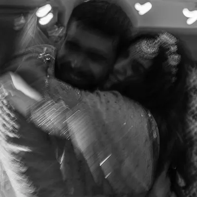 This blurry, black and white hug is one of my signature styles. It’s an abstract way to represent a powerful emotion, focusing on the feeling of the embrace rather than the details. It’s a perfect example of capturing real moments over poses.
