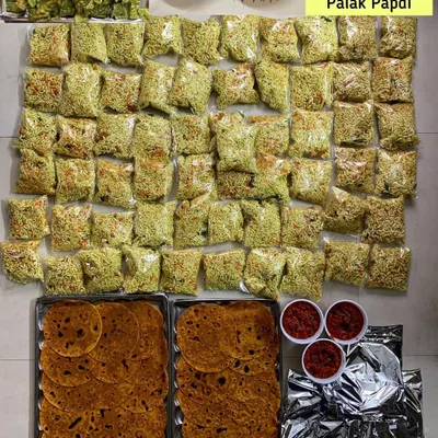 A large order of travel food for about 60 people going on a train journey. I packed Masala Theplas, Tomato Chutney, Mirchi Koota, and Palak Papdi to keep them well-fed on their trip.