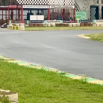 A view of our track and pit lane area on a quiet day. The checkered flag motif and professional setup show that we live and breathe racing.