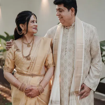 A beautiful moment between the bride's parents. I had the pleasure of doing the makeup for the bride's mother, focusing on a graceful and radiant look that complemented her elegant golden saree.
