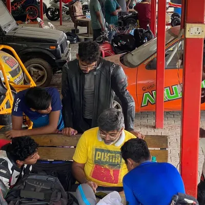 Here I am with a group of students during a theory session. We gather around to discuss the plan for the day, review feedback, and answer every question to ensure the concepts are clear.