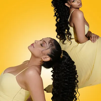 A playful and artistic shot from our Summer Edit campaign. This look features a high curly ponytail and creative eye makeup, showcasing our ability to create trendy, high-fashion looks.