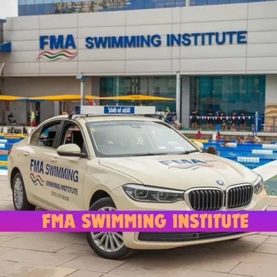 FMA is the number one swimming institute in Gurugram, Mumbai, and Delhi. Our branded car is a symbol of our commitment to reaching swimmers everywhere, parked here in front of one of our modern facilities.