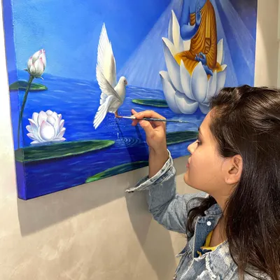 This is me with one of my favorite personal pieces. Painting is my meditation, and I started Brushstrokes to share that feeling of peace and joy with others. I truly believe everyone has an artist inside them.