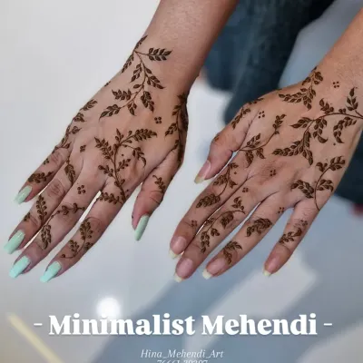 A very popular minimalist design featuring a delicate leafy vine that gracefully covers the back of the hands. It's modern, chic, and perfect for any occasion.