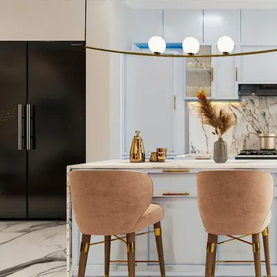This kitchen design is all about clean lines, soft tones, and bold contrast. The pastel blue cabinetry is paired with a dramatic black refrigerator and elegant brass hardware for a look that is both fresh and sophisticated.