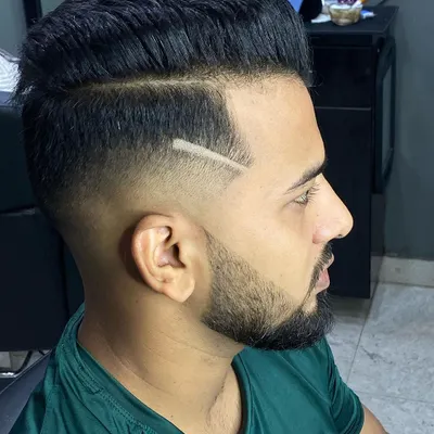 A close-up of a sharp, razored line accent on a skin fade. This small detail adds a lot of character to the haircut and shows my commitment to precision detailing.