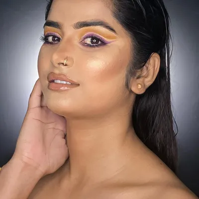 A professional portfolio look featuring a colorful graphic eyeliner. This is the kind of high-impact, clean work we train our students to produce for their own professional portfolios.