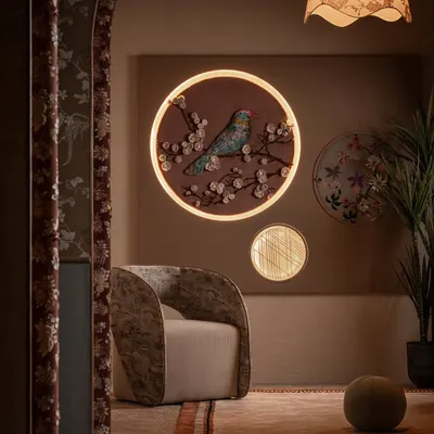 This is Zone One, the quiet invitation into the world of Moire. We designed this space to feel warm and layered, with a custom fabric mural featuring an embossed bird, a sculptural armchair, and a bespoke rug that together set a thoughtful, personal tone.