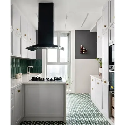 The kitchen in the "Cityscape Serenity" home. I continued the green from the passage onto the floor tiles and the stunning emerald green backsplash. The rest of the kitchen is white because, for busy working women, one look should be enough to spot any mess.