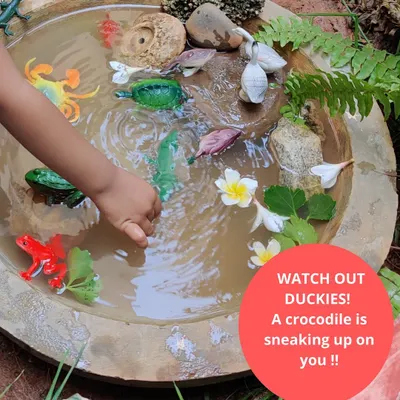 Watch out, duckies. A crocodile is sneaking up on you. Our DIY pond is a hub for imaginative play and learning about habitats. Children create complex stories, learning about predator and prey relationships in a safe, hands-on way.
