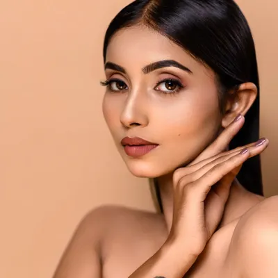 A classic beauty shot with a focus on clean, perfect skin. My retouching process, including dodge and burn techniques, ensures a natural yet polished finish, ideal for a makeup artist or model portfolio.