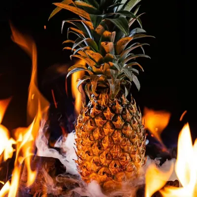The start of our fiery shoot for Hundo Pizza. We used a real pineapple set on burning coals to create a dramatic and elemental image that ties into their brand's edgy theme.