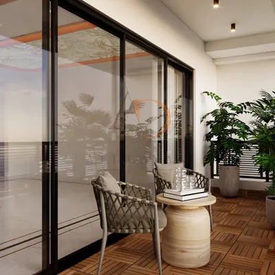 A cozy balcony with wooden deck tile flooring, comfortable rope-woven chairs, and lush potted plants creating a private urban oasis.