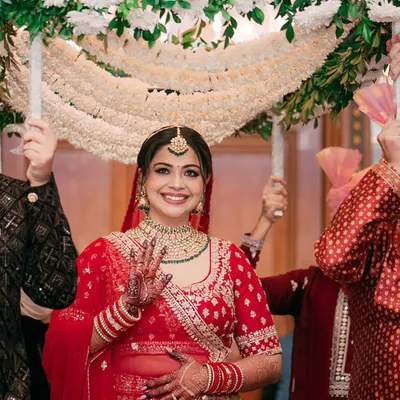 The moment everyone waits for. We capture the bride's grand entrance under the phoolon ki chadar, a walk filled with anticipation, love, and the blessings of her family.