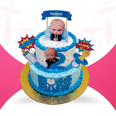 This two-tier Boss Baby cake is a hit for toddler birthdays. Made with a delicious pineapple flavor, the design includes character toppers, a pacifier, and a milk bottle, capturing the playful theme perfectly for a second birthday celebration.