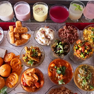 A wide view of my completely dairy-free 56 Bhog, a traditional offering of 56 dishes for Janmashtami. This demonstrates the scale and variety possible in plant-based festive cooking, ensuring traditions can be celebrated with compassion.
