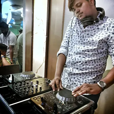 In the zone, mixing tracks and feeling the music. My focus is always on the crowd, adjusting the playlist in real time to match the energy of the room and keep the party going strong.
