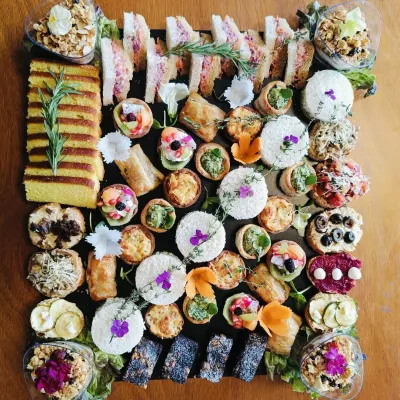 Small sandwiches and tiny treats fill our Tea and sandwich platter, with savoury pastries and little tarts across the board.